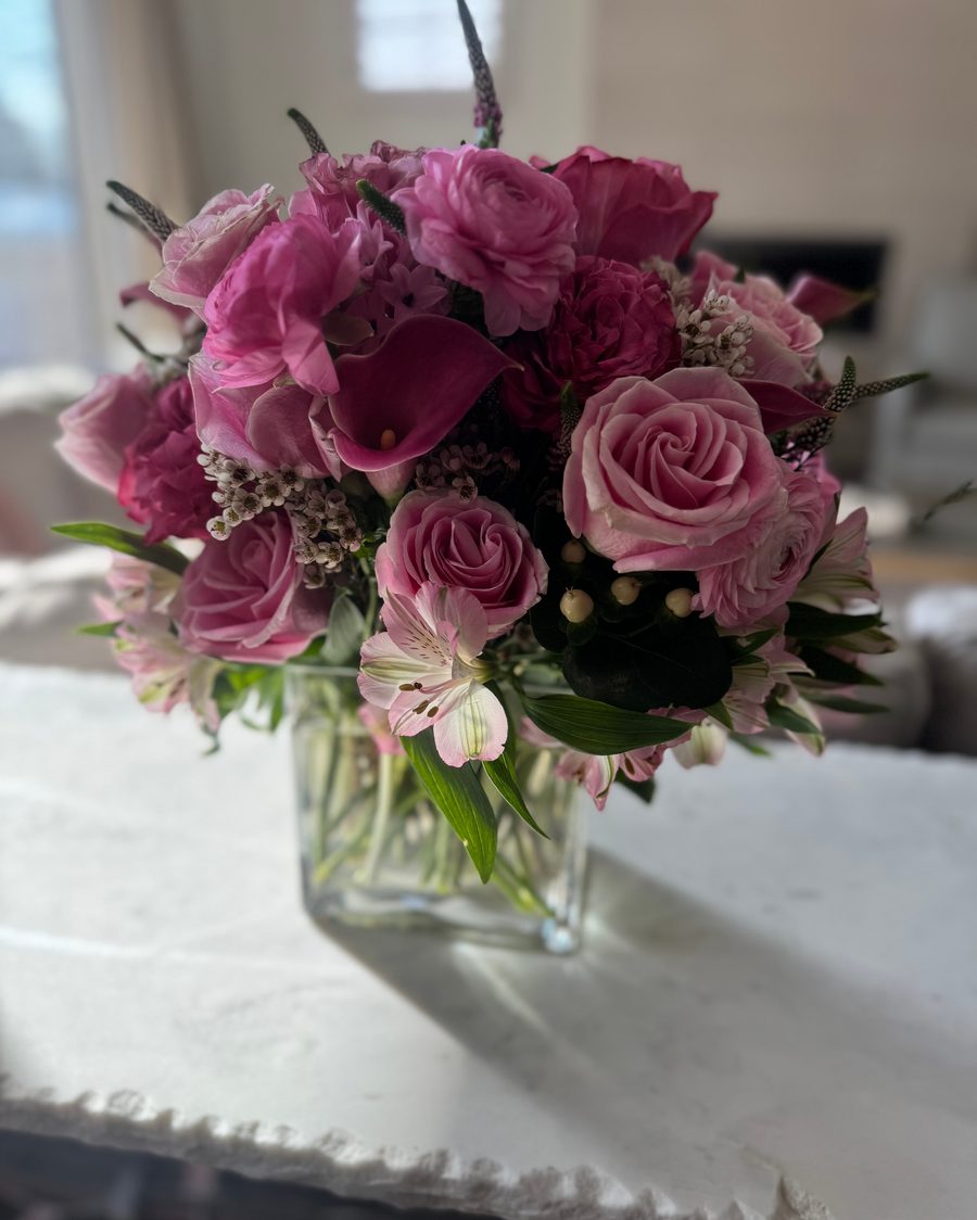 A romantic pink rose and ranunculus arrangement by Red Fern Florals