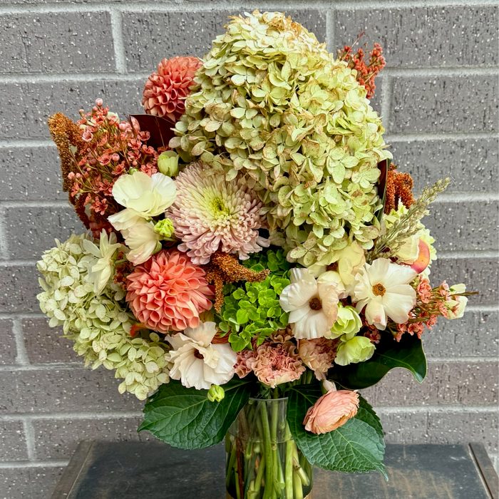 Tall hydrangea arrangement with dahlias and coral blooms