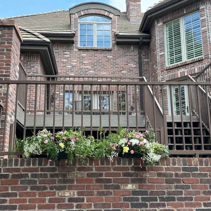 Window box planters on a brick home