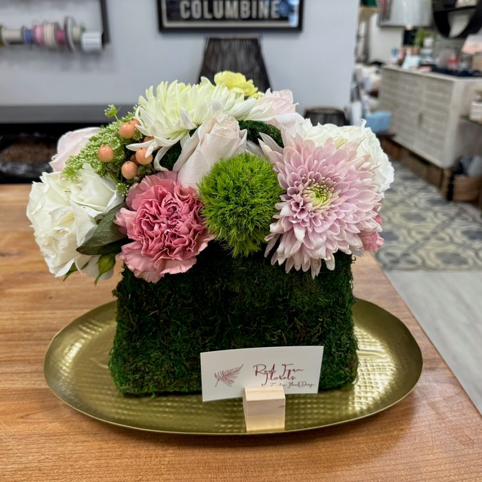 Custom moss-cube arrangement with pink, white, and green blooms